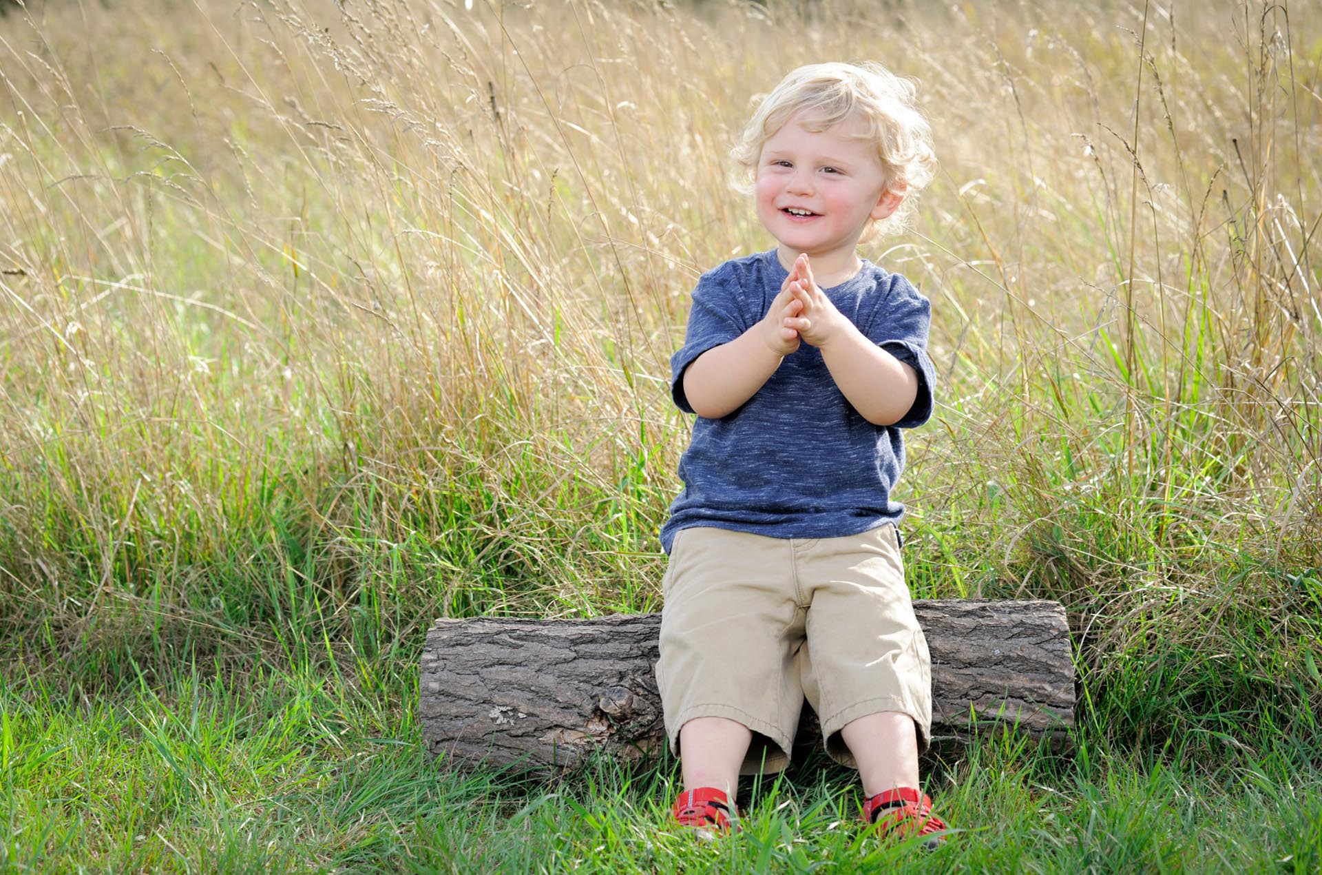 Best Troy lifestyles photographer's fun and candid children's and kids photos of a Michigan family playing in Metro Detroit and Troy, Michigan as a happy little bump on a log.