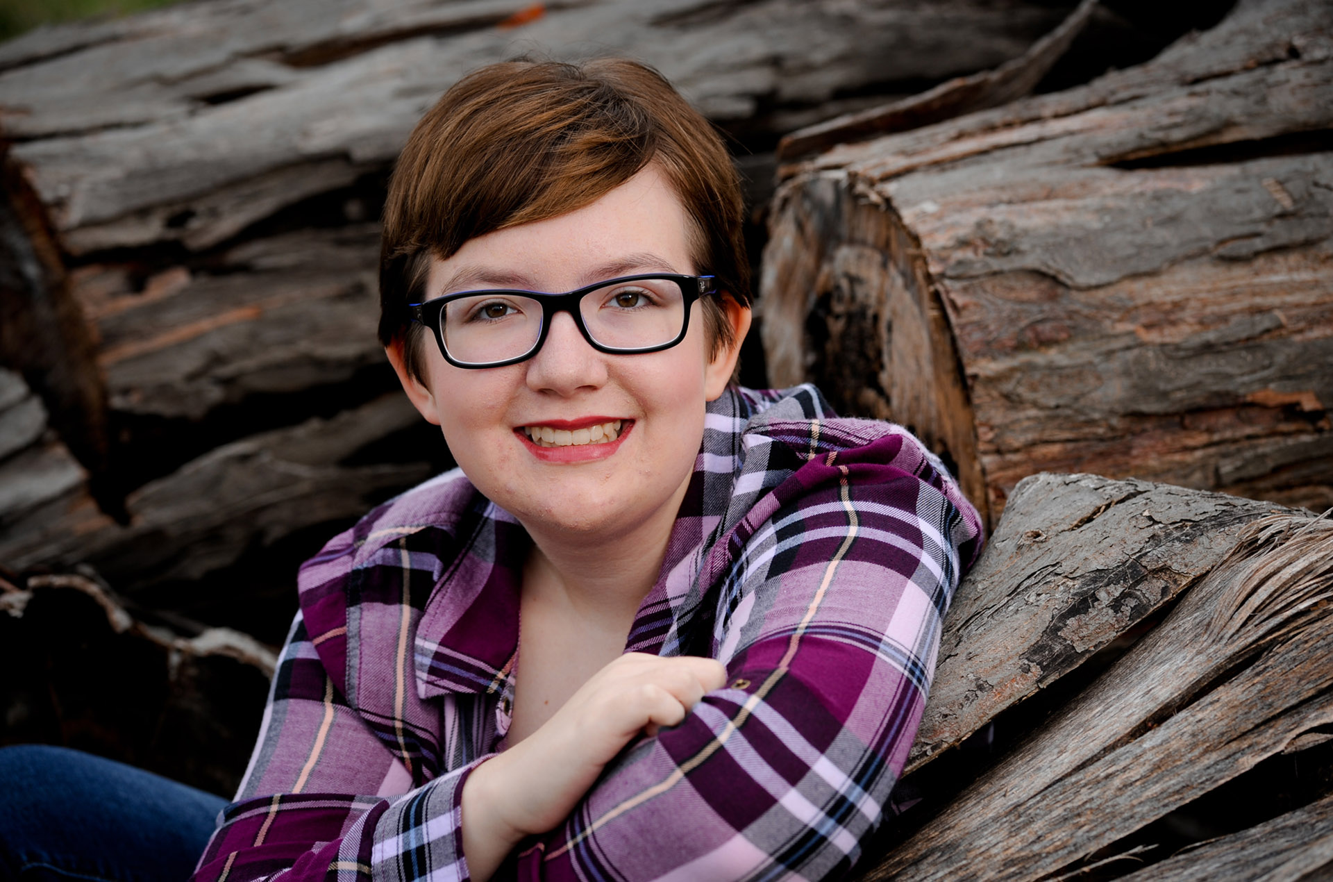 Best Troy lifestyles lifestyles photographer photographs a senior's portrait session with a more formal and classic high school senior in a woodpile in the Troy, Michigan area.