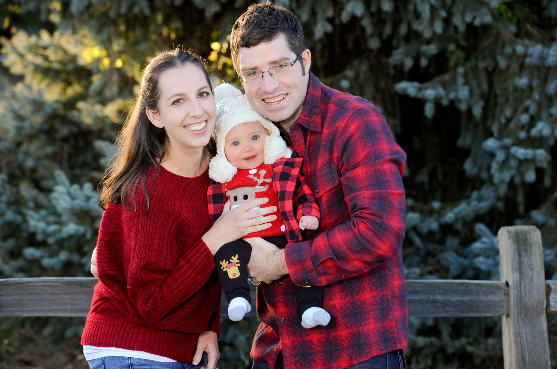 Best Troy lifestyles photographer portraits of a newly family couple about to kiss for this amazing personality filled children's and kids potrait in Metro Detroit and Troy, Michigan.